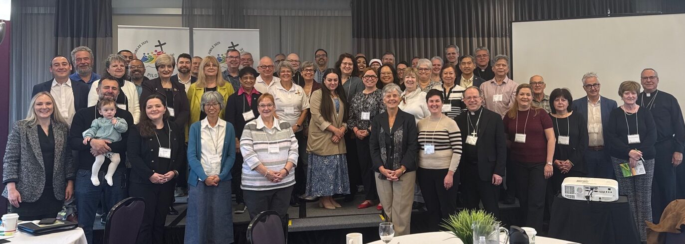 Participants at a conference gather for a group photo