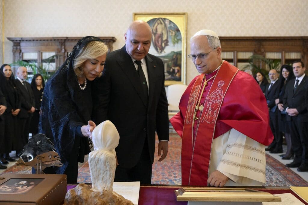 Nehmat Aoun, wife of President Joseph Aoun of Lebanon, shows Pope Leo XIV a bust of Lebanese St. Charbel.