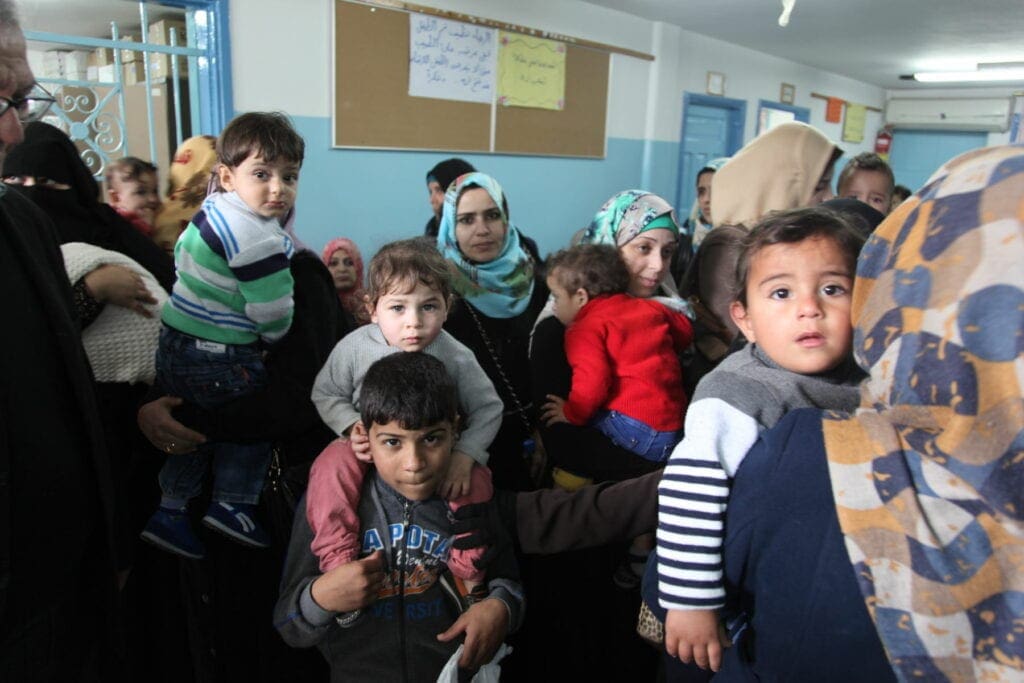 people gather in a clinic for health care in Gaza City in the Palestinian territories.