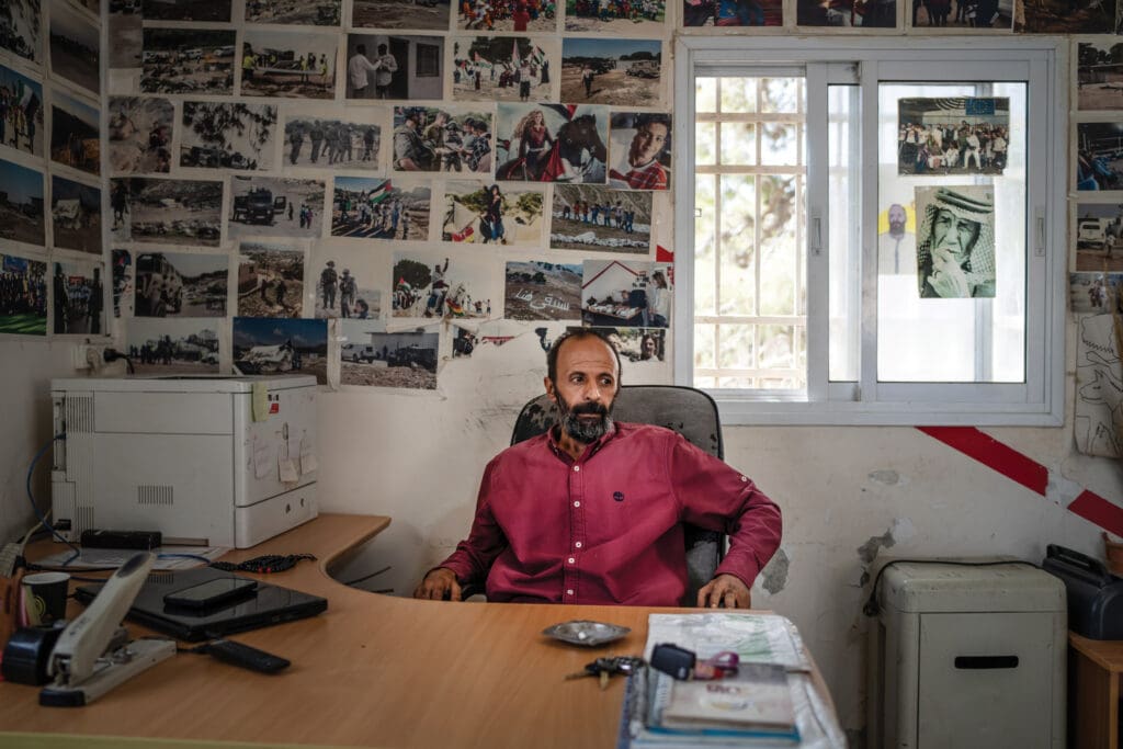 A man sitting at a desk.