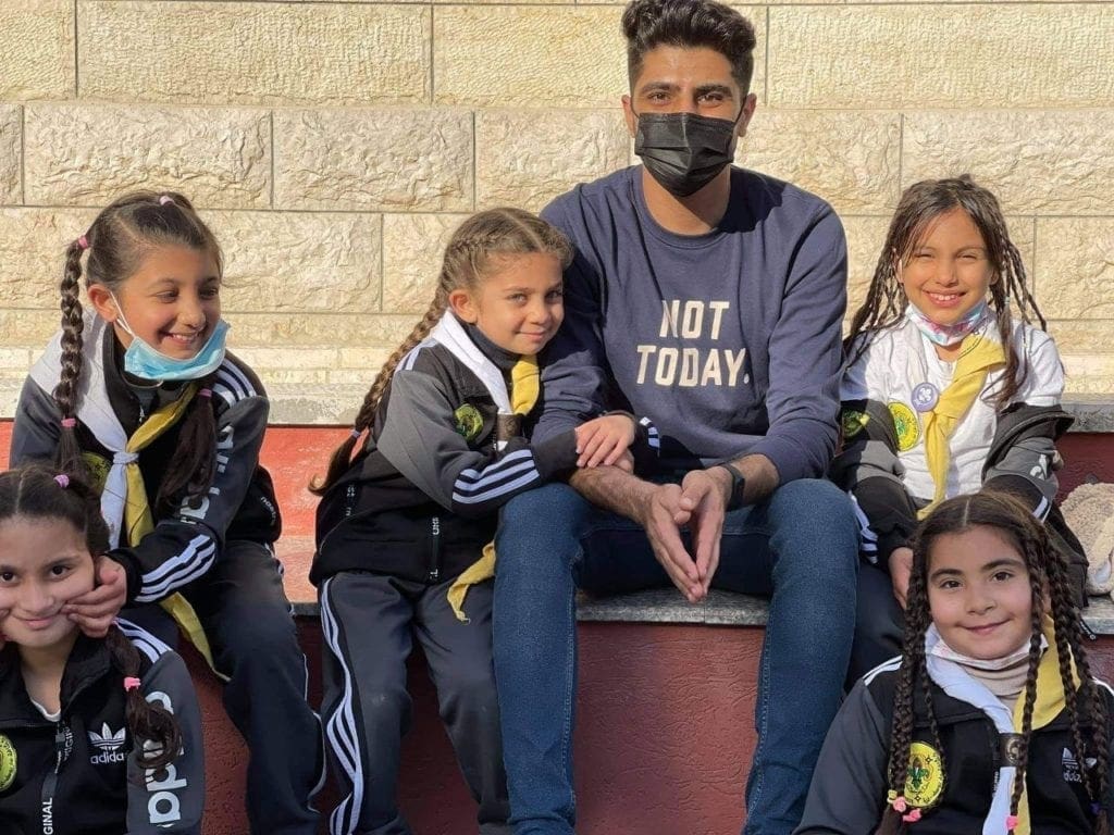 Hussam Saba, a recipient of the CNEWA-Pontifical Mission Christian Student Scholarship, volunteers with the St. Joseph Scouts in Gaza.