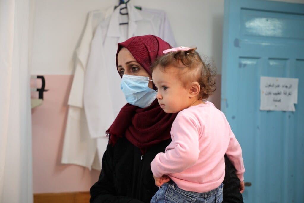 Jori Al-Qerm 16 months, Aya Al-Qerm, 28, seeks medical assistance for her 16-month-old daughter, Jori, at a clinic of the Near East Council of Churches in early October.