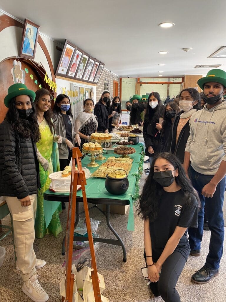 The 10th-grade Sunday school students at St. Thomas the Apostle Syro-Malabar Cathedral hold a bake sale on 20 March to benefit CNEWA's relief efforts for Ukraine.