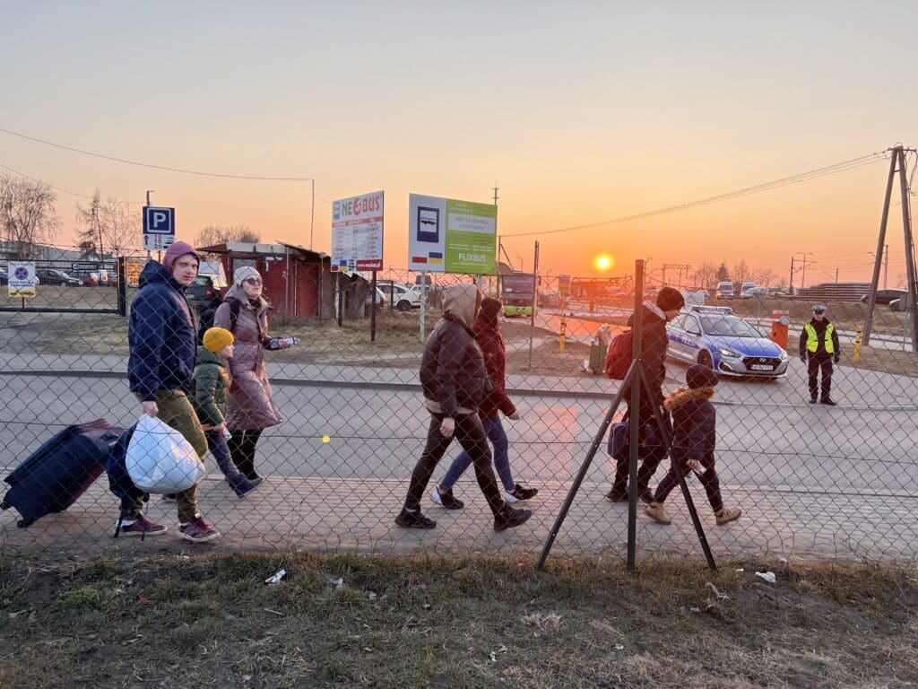 Refugees arrive from Ukraine at Medyka border crossing in Poland.