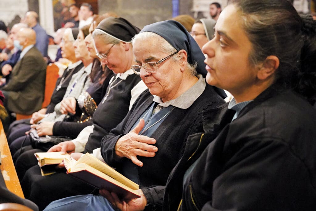 Nuns sit together.