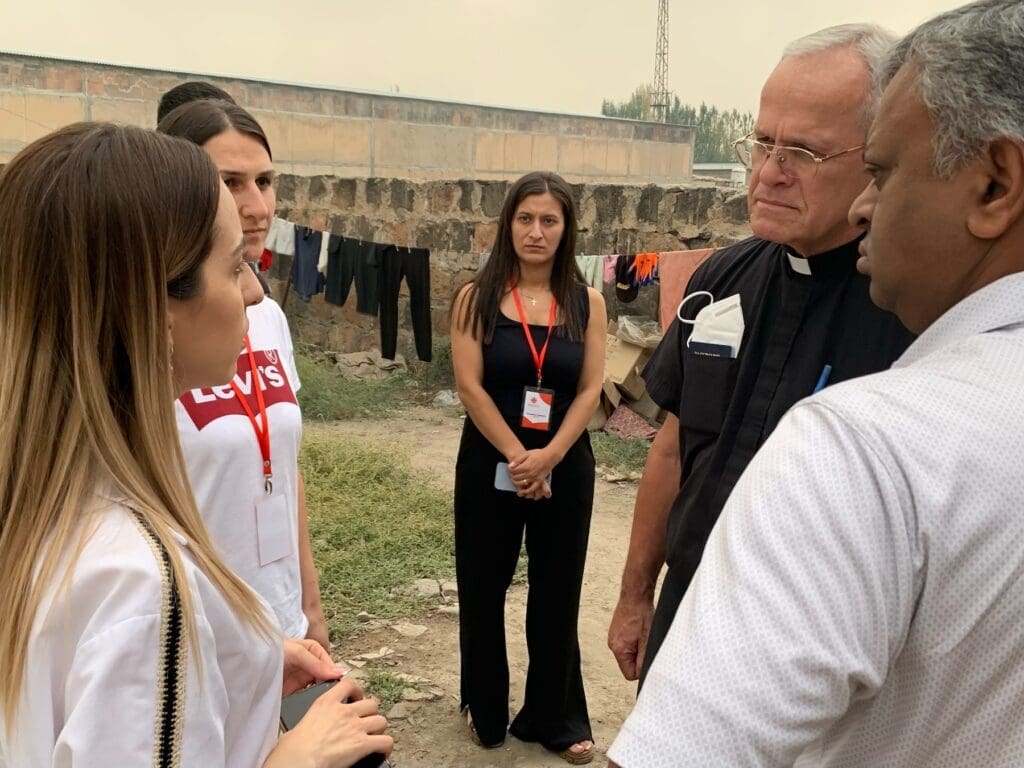 Caritas Armenia staff talk to Monsignor Peter Vaccari, CNEWA president, in Artashat, Armenia.