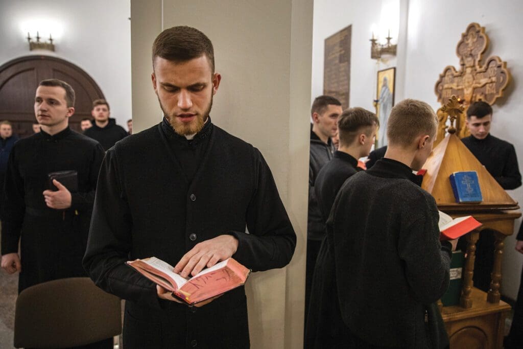 Seminarians pray at a seminary in Kyiv