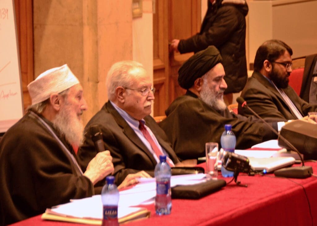 Father Elias Mallon, S.A., sitting on a panel with other religious leaders