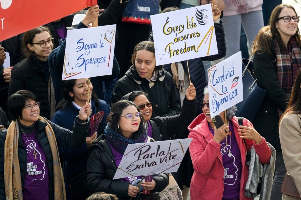 Group of women with signs in support of hope and freedom.
