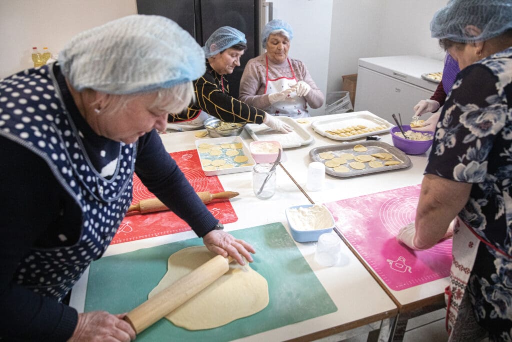 Women making pierogi.