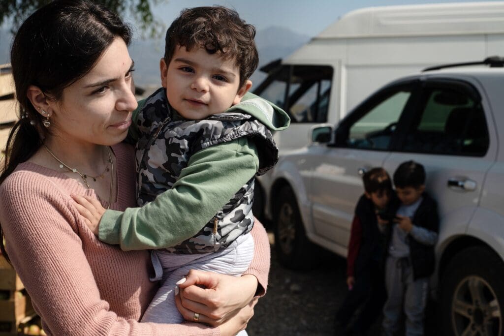 Armenian mother holding her infant boy.