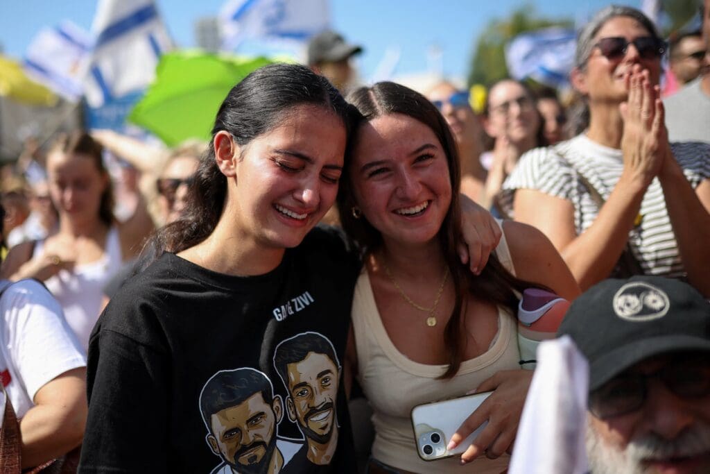 Israelis celebrate the release of hostages taken by Hamas in Tel Aviv.