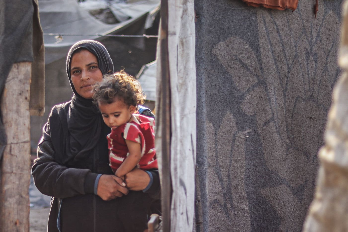 Woman holding a child.