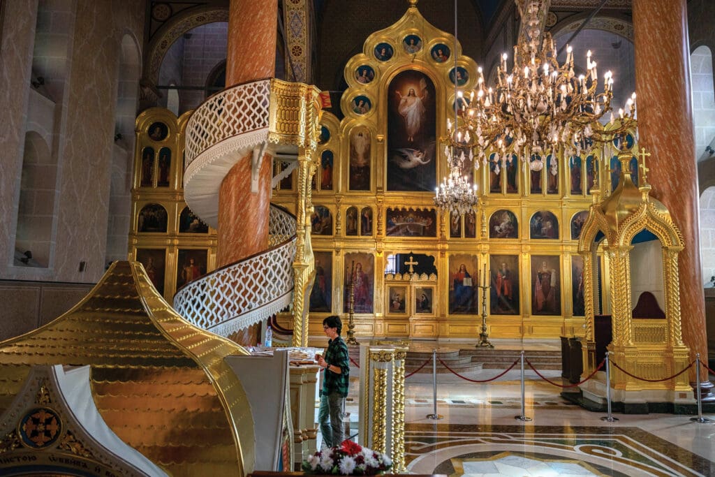 Woman praying at the Serbian Orthodox Cathedral Church of the Nativity of the Theotokos in Sarajevo.