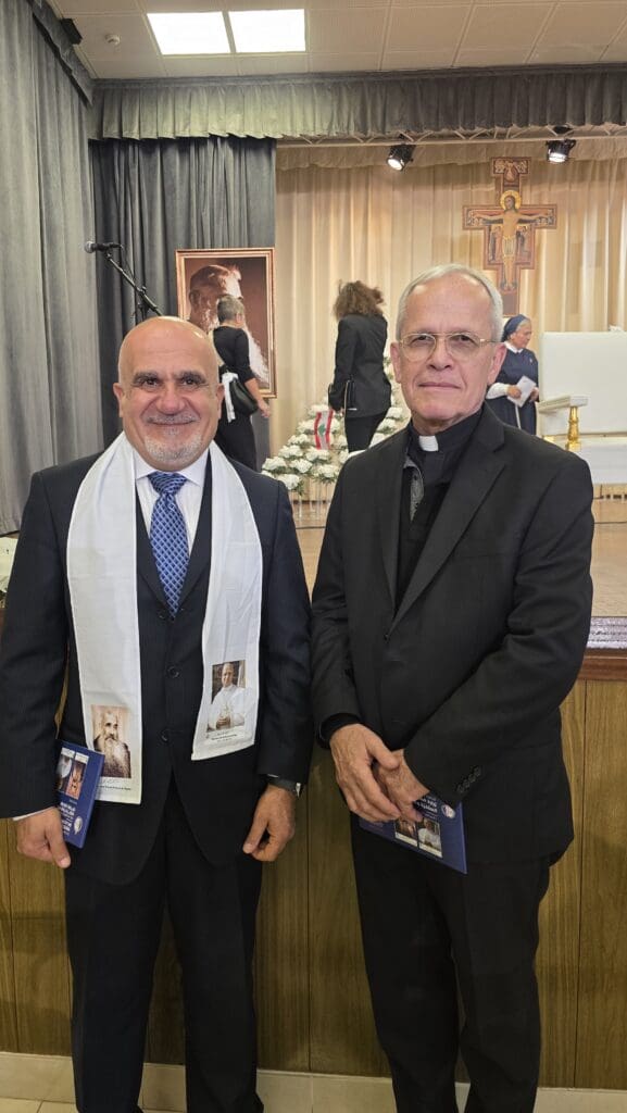 Michel Constantin, director of CNEWA-Pontifical Mission’s regional office in Beirut, and Msgr. Peter I. Vaccari, president of CNEWA, wait for the arrival of Pope Leo XIV at Lebanon's Hospital of the Cross.