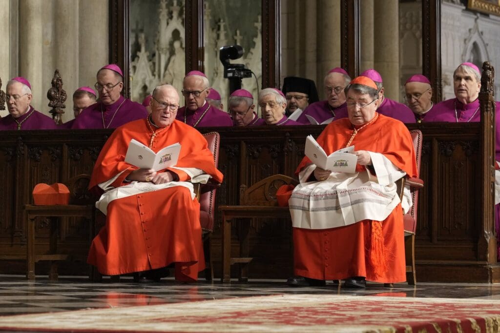 Cardinal Timothy M. Dolan, left, retired archbishop of New York, and Cardinal Christophe Pierre, papal nuncio to the United States.