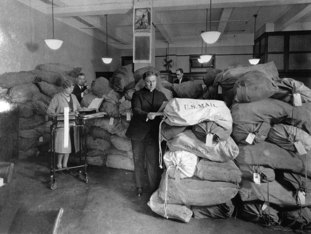 Jesuit Father Edmund A. Walsh, the first president of CNEWA, sifts through the mail at CNEWA’s offices in New York City.