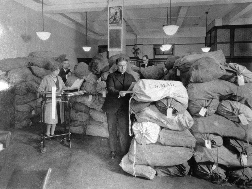 Jesuit Father Edmund A. Walsh, the first president of CNEWA, sifts through the mail at CNEWA’s offices in New York City.