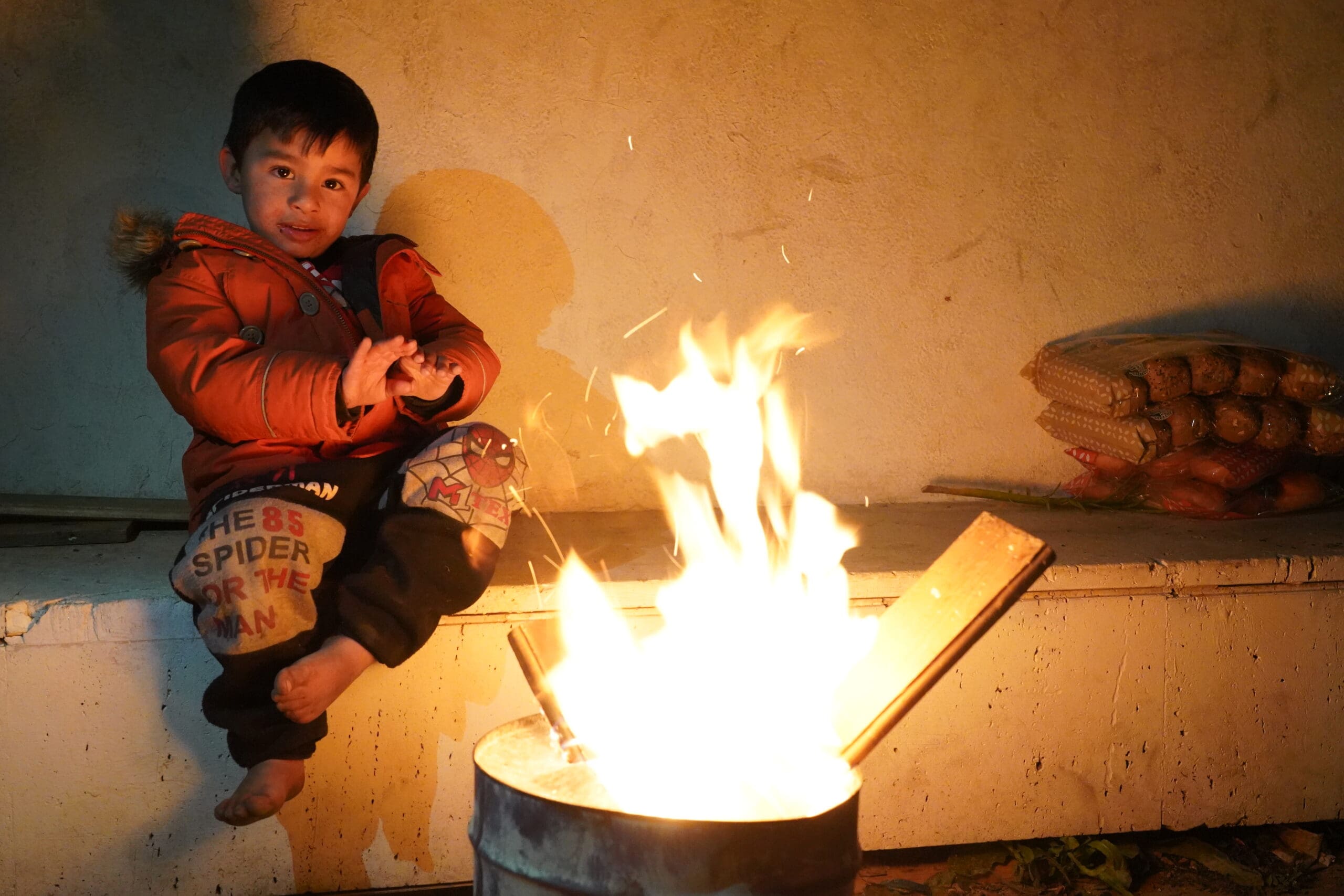 Displaced children warm themselves in Beirut’s Martyrs’ Square.
